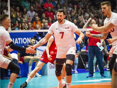 Canada's Stephen Timothy Maar celebrates a point with teammates in Sunday's match against Serbia.