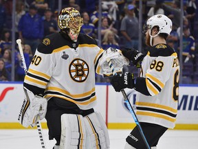 Boston Bruins goaltender Tuukka Rask (40) celebrates with right wing David Pastrnak (88) after defeating the St. Louis Blues in game six of the 2019 Stanley Cup Final at Enterprise Center. (Jeff Curry-USA TODAY Sports)