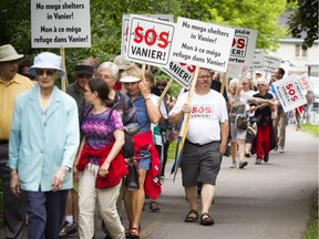 Residents opposed to the Salvation Army's plans for a new shelter and facility in Vanier took their message to the streets, marching through their community on Sunday, June 24, 2018.   Ashley Fraser/Postmedia