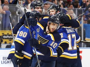 Brayden Schenn of the St. Louis Blues celebrates his empty-net goal with Jaden Schwartz and Ryan O'Reilly in Game 4  of the 2019 Stanley Cup Final at Enterprise Center on June 3, 2019 in St Louis. (Bruce Bennett/Getty Images)