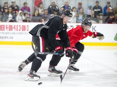 The Ottawa Senators development camp was at the Bell Sensplex for a 3-on-3 tournament Saturday, June 29, 2019. Lassi Thomson, left, battles to keep the puck away from Alex Formenton.