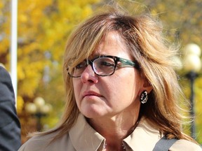 Pembroke dentist Christy Natsis leaves the Pembroke courthouse on Wednesday, Oct. 14, 2015.