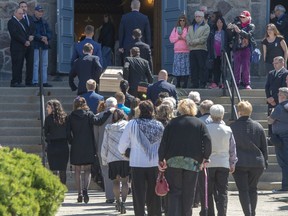 The casket of a seven-year-old girl who was found in critical condition inside of a home and later died is carried to the church for funeral services, Thursday, May 9, 2019 in Granby, Que.