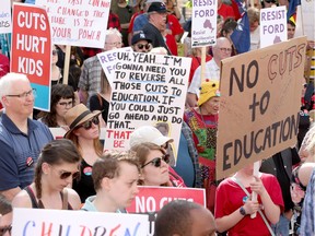 Teachers, along with other union groups, including the Ontario Federation of Labour (OFL), rally outside the Ottawa courthouse on Elgin Street as part of a province-wide Day of Action recently.