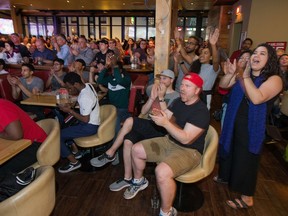 Toronto Raptors fans cheer on their team in Game 5 of the 2019 NBA FInals against the Golden State Warriors at the Sens House in the ByWard Market. Photo by Wayne Cuddington / Postmedia