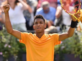 Canada's Felix Auger-Aliassime celebrates his win over Greece's Stefanos Tsitsipas in their men's singles quarterfinal match at the ATP Fever-Tree Championships at Queen's Club in London on Friday, June 21, 2019.