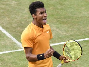 Canada's Felix Auger-Aliassime reacts after defeating Germany's Dustin Brown in their quarterfinal match at the ATP Mercedes Cup in Stuttgart, Germany, on Friday, June 14, 2019.