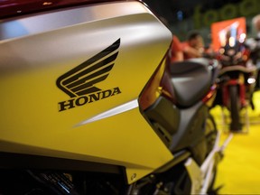 The Honda logo is seen on a motorbike at the "Motorcycle Live" show on November 19, 2016 in Birmingham, England.