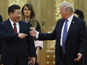 U.S. President Donald Trump and China's President Xi Jinping arrive at a state dinner at the Great Hall of the People on November 9, 2017 in Beijing, China.