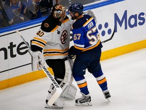 The St. Louis Blues' David Perron gives Boston Bruins goaltender Tuukka Rask a piece of his mind after a whistle during the third period in Game 3. The timing seemed odd, writes Don Brennan.