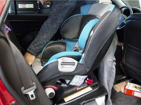 FILE: A child seat being installed.