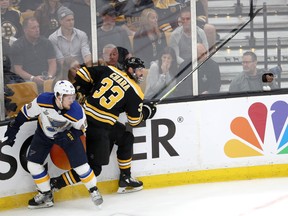 Blues’ Ivan Barbashev gets tangled up with Bruins’ Zdeno Chara earlier in the Stanley Cup final. Barbashev will sit out Game 6 for his illegal hit in Game 6. (GETTY IMAGES)