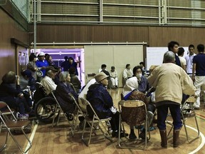 Residents who were evacuated from their homes after an earthquake are seen at a gymnasium of Iwafune junior high school acting as a makeshift evacuation center, in Murakami, Niigata prefecture, Japan June 19, 2019, in this photo taken by Kyodo.