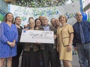 Giuseppa Lanteri and her husband, Nunzio, are surrounded by family as they receive their Canadian record $65 Million Lotto Max cheque at a ceremony Monday, June 17, 2019 in Montreal.THE CANADIAN PRESS/Ryan Remiorz ORG XMIT: RYR101