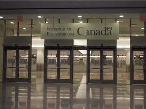 NATIONAL POST STAFF PHOTO // TORONTO,ON.NOV.29.2006 -- TERMINAL 1 -- Pearson Airport's new Terminal 1 is pictured in Toronto Thursday, November 30, 2006. For Toronto Story by Peter Kuitenbrouwer Staff Photo: Brent Foster/National Post ADD: sign says Welcome to Canada - Canadian Customs and Immigration /pws // na111914-Refugees-Welfare //1109 na border ORG XMIT: POS2013022216575367