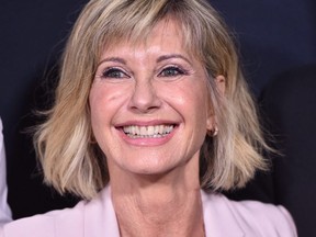 Olivia Newton-John attends the Academy Presents "Grease" (1978) 40th Anniversary at the Samuel Goldwyn Theater in Beverly Hills, Calif., on Aug. 15, 2018.