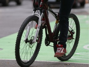 A bicycle navigates downtown traffic.