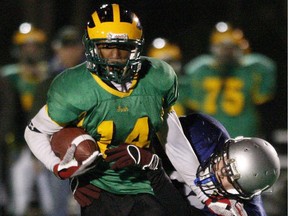 Ashton Dickson, from St. Patrick's, runs with the football during the National Capital Secondary School Athletic Association's 2009 Senior "Tier 2" championship game.