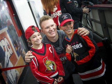 Brady Tkachuk poses with nine-year-old Pierce Barnes and eight-year-old Ryder Rakowski, who was proudly wearing a Tkachuk jersey.