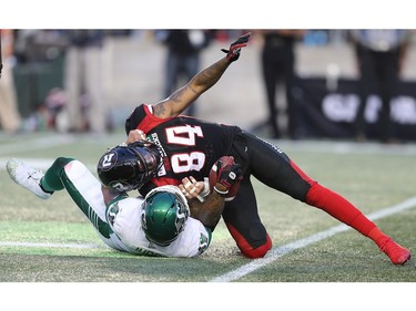 R.J Harris is hauled down by Cameron Judge in the first half as the Ottawa Redblacks take on the Saskatchewan Roughriders in CFL action at TD Place in Ottawa. Photo by Wayne Cuddington / Postmedia