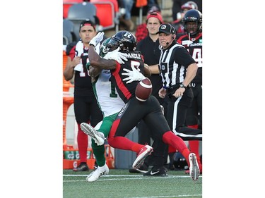 Chris Randle is called for pass interference on Shaq Evans  in the first half as the Ottawa Redblacks take on the Saskatchewan Roughriders in CFL action at TD Place in Ottawa. Photo by Wayne Cuddington / Postmedia