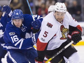 Cody Ceci attempts to slow down the Maple Leafs' Mitch Marner. There's talk that the Senators may be close to dealing Ceci to Toronto for defenceman Nikita Zaitsev.