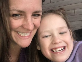 Photo of Laurie Giesbrecht and her seven-year-old daughter Jorja. A Manitoba woman says her “biggest fear” came true when a staff member at her daughter’s elementary school allegedly put her child in a headlock and dragged her down the hallway.