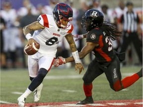 Alouettes Quarterback Vernon Adams Jr. eludes Redblacks' Deshawntee Gallon ,June 6, 2019.  Adams is the latest Montreal quarterback trying to fill the large shoes of all-time great ANthony Calvillo.