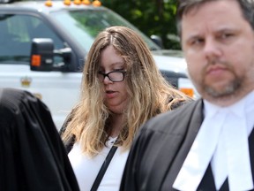 Kirsten Pemberton leaves the Lennox and Addington County court house after receiving her sentence on Wednesday, July 10, 2019, walking with her defence, Dawn Quelch and Paul Blais.