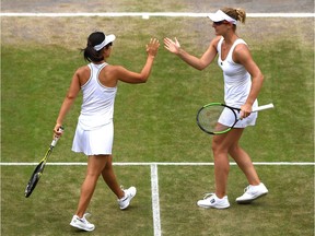 Gabriela Dabrowski of Ottawa and Yifan Xu of China celebrate in their women's doubles semi-final victory against Barbora Krejcikova of Czech Republic and Katerina Siniakova of The Czech Republic at the All England Lawn Tennis and Croquet Club on Friday, July 12, 2019 in London, England.