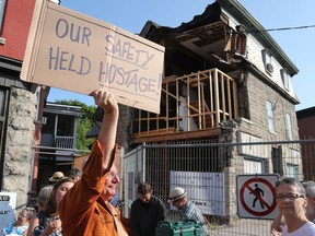 Demonstrators against the closed sidewalk and lack of movement at the Magee House in Ottawa, July 24, 2019.