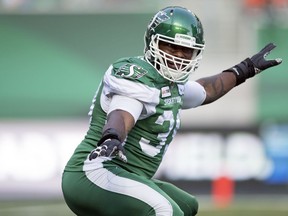 Saskatchewan Roughriders defensive end Charleston Hughes celebrates one of his two first-half sacks against the B.C. Lions