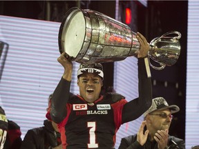 2016 - Ottawa Redblacks Henry Burris hoists the Grey Cup over his head after the 104th CFL Grey Cup.