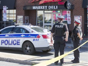 Police cordon off the scene as an apparent homicide occurred along Dalhousie Street in the Byward Market on early Monday morning.