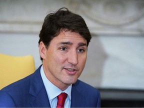 In this file photo taken on June 20, 2019 Canada's Prime Minister Justin Trudeau speaks during a bilateral meeting with US President Donald Trump in the Oval Office of the White House in Washington, DC.