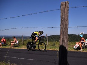 Australia's Jack Haig rides past fans during the thirteenth stage of the 106th edition of the Tour de France cycling race, a 27.2-km individual time-trial in Pau, on July 19, 2019. (MARCO BERTORELLO/AFP/Getty Images)