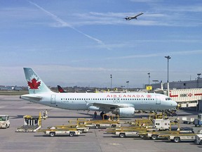 In this file photo taken on May 1, 2018, an Air Canada plane sits on the tarmac at Trudeau airport near Montreal. (DANIEL SLIM/AFP/Getty Images)
