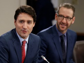 Canada's Prime Minister Justin Trudeau (L) and his then principal secretary Gerald Butts take part in a meeting with Italy's Prime Minister Paolo Gentiloni (not pictured) on Parliament Hill in Ottawa, Ontario, Canada, on April 21, 2017. (REUTERS/Chris Wattie)
