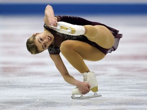 Canada’s Alaine Chartrand performs her women’s free program routine during an April competition in Japan. The former Nepean Skating Club athlete is taking an unspecified break from competitive skating, but the two-time national champion clarified that she is not retiring from the sport. (AP FILES)