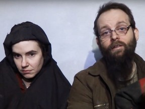 A screen capture from  YouTube of Taliban video showing hostages Caitlan Coleman and Joshua Boyle during their captivity.