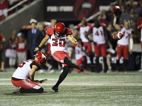 CP-Web.  Calgary Stampeders kicker Rene Paredes, makes the winning kick as teammate Rob Maver holds the ball during second half CFL action against the Ottawa Redblacks in Ottawa on Thursday, July 25, 2019. The Stamps took the Redblacks 17-16.
