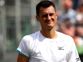 Bernard Tomic of Australia reacts in his men's singles first round match against Jo-Wilfred Tsonga of France during Wimbledon at All England Lawn Tennis and Croquet Club on July 2, 2019 in London. (Clive Brunskill/Getty Images)