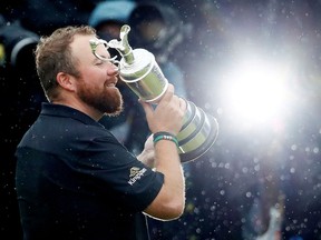 Republic of Ireland's Shane Lowry celebrates with the Claret Jug trophy after winning The Open Championship on Sunday, July 21, 2019.