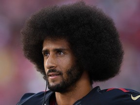 Colin Kaepernick of the San Francisco 49ers stands on the sidelines during their NFL game against the Arizona Cardinals at Levi's Stadium on Oct. 6, 2016 in Santa Clara, Calif.