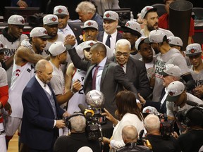 Kawhi Leonard (left) and team president Masai Ujiri shake hands after winning the East final. (Jack Boland/Toronto Sun)