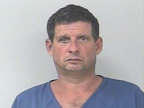 Michael Monahan, 48, was arrested by police after challenging them to a fight. He was found passed out at a parking lot outside a Florida strip club. Monahan claimed he drank 33 beers. St. Lucie County Sheriff's Office/handout photo