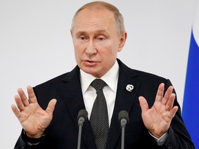 Russian President Vladimir Putin speaks to the media at the G20 summit in Osaka, Japan, June 29, 2019.