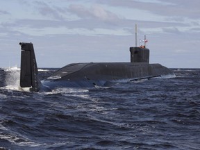 A file picture taken on July 2, 2009, shows new Russian nuclear submarine, the Yuri Dolgoruky, driving in the water area of the Sevmash factory in the northern city of Arkhangelsk.