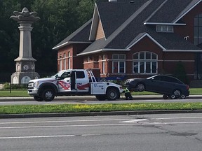 A stunt driver's vehicle is taken to "car jail" following an arrest Saturday morning.