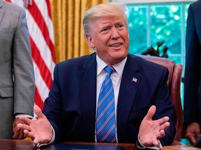 US President Donald Trump speaks to the press after signing a bill for border funding legislation in the Oval Office at the White House in Washington, D.C., on July 1, 2019.